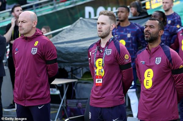 Members of Carsley's backroom staff including former Chelsea defender Ashley Cole (right) sang 'God Save The King'