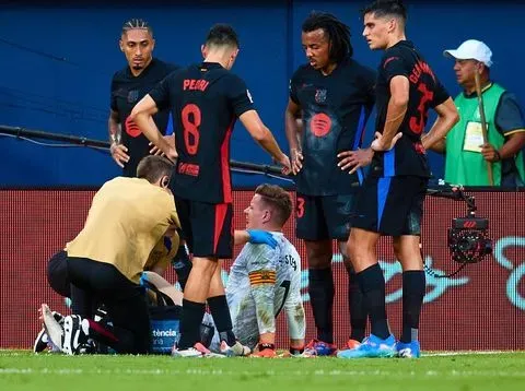 VILLARREAL, SPAIN - SEPTEMBER 22: Marc-Andre Ter Stegen of Barcelona lies injured on the pitch during the LaLiga match between Villarreal CF and FC Barcelona  at Estadio de la Ceramica on September 22, 2024 in Villarreal, Spain. (Photo by Omar Arnau/Quality Sport Images/Getty Images)