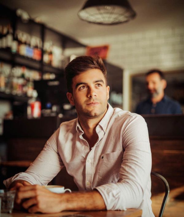 man in a coffee shop by himself