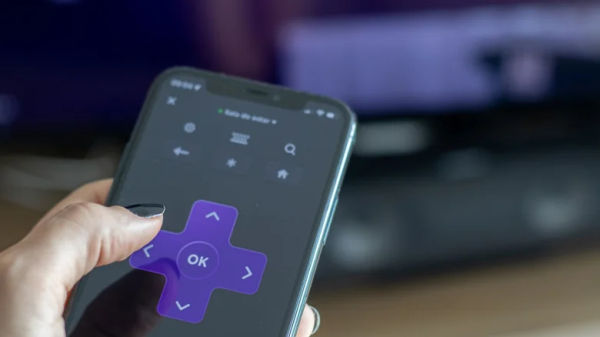 woman using roku mobile app