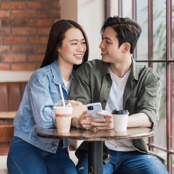 man and woman having coffee