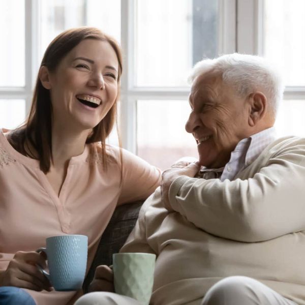 Young woman is friends with an elderly man