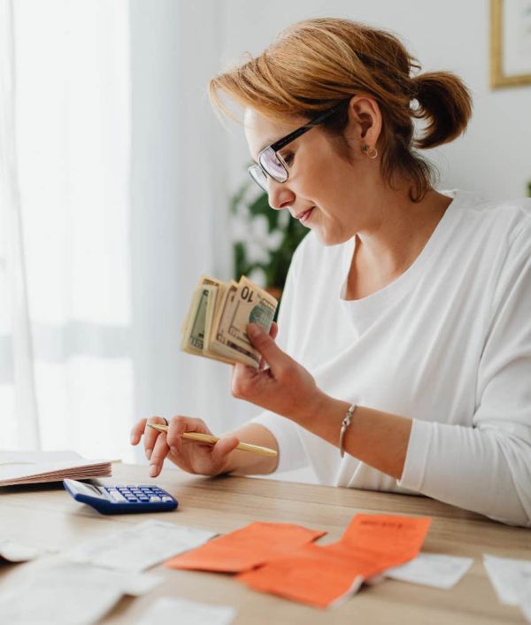 Woman going through expenses and trying to budget