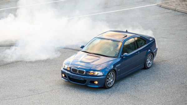 2011 M3 doing donuts in a parking lot