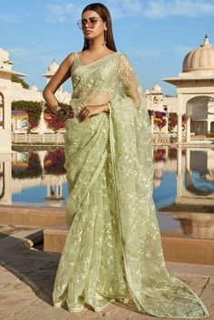 This contains an image of: Sabyasachi pastel color saree 