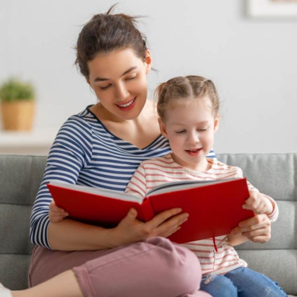 mom reading to daughter 