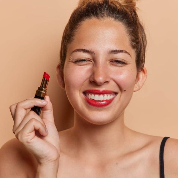 Woman who wears red lipstick as an adult