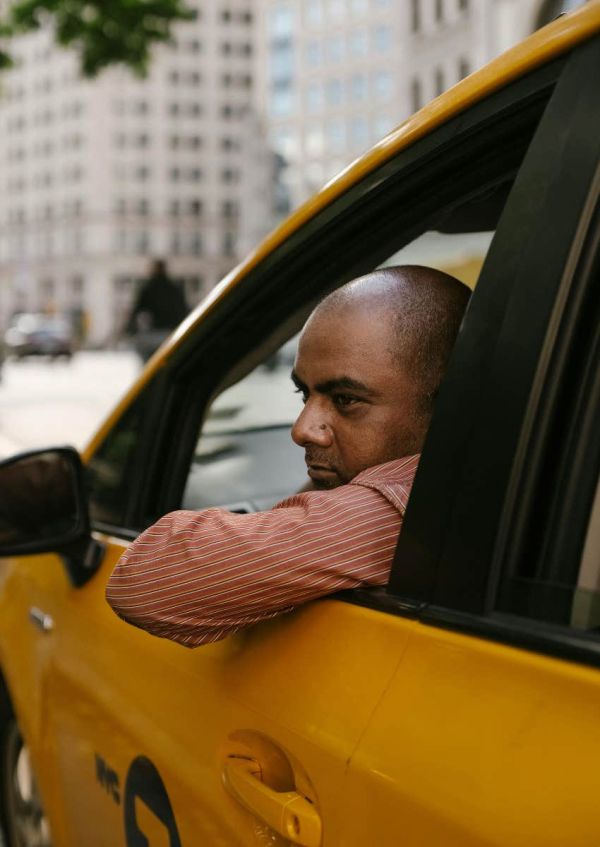 taxi driver leaning out window