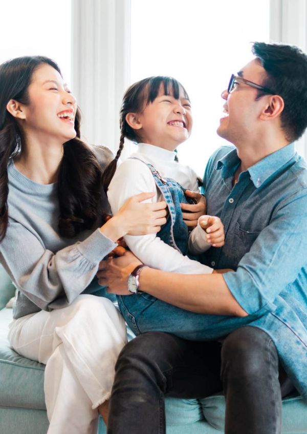 Happy family sitting together