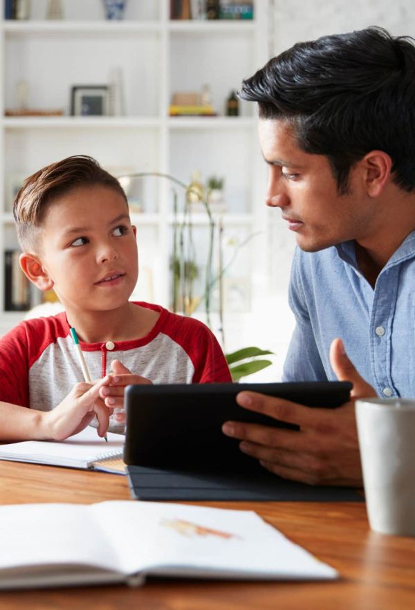 father helping son with homework