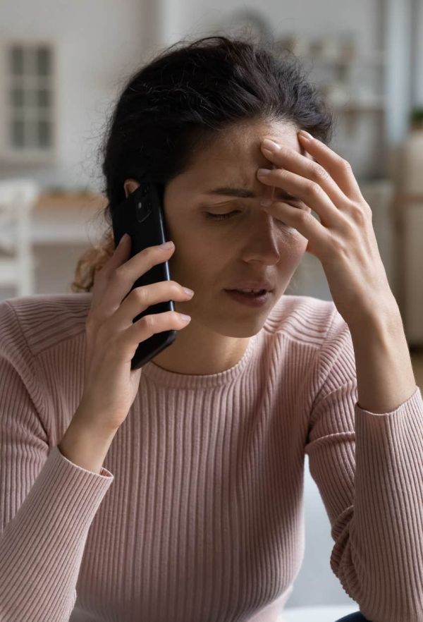 Upset woman on the phone with her friends