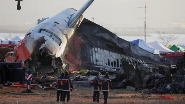 Rescuers work near the wreckage of the Jeju Air aircraft that went off the runway and crashed at Muan International Airport, in Muan, South Korea, December 30, 2024. REUTERS/Kim Hong-Ji TPX IMAGES OF THE DAY