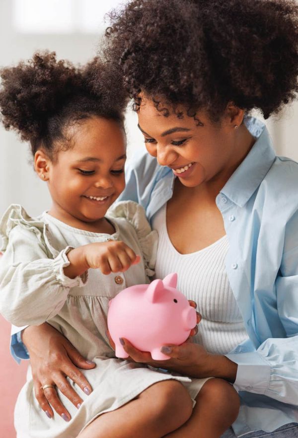 Parent teaching her kid about financial literacy