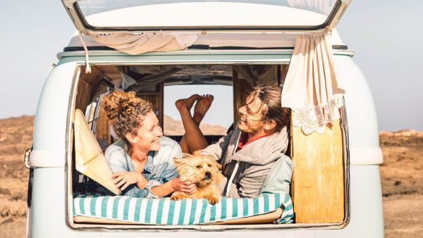 Millennial couple living out of a van with their dog