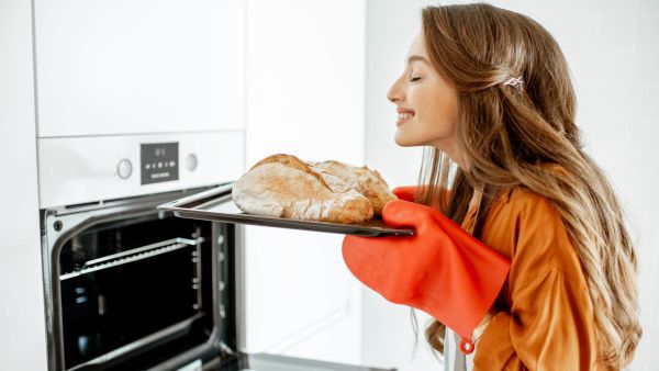 Gen Z woman doing boomer hobby baking bread