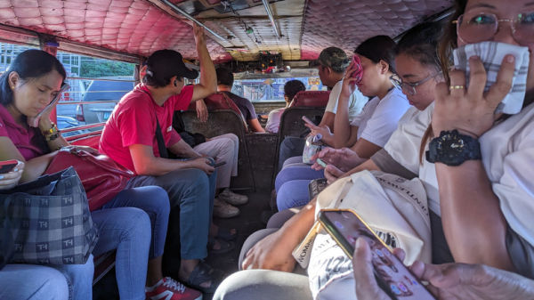 Driver and passengers of a jeepney, the most famous public transportation in the Philippines