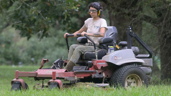 Lazer E-Series Exmark ride on mower driven by professional with eye protection