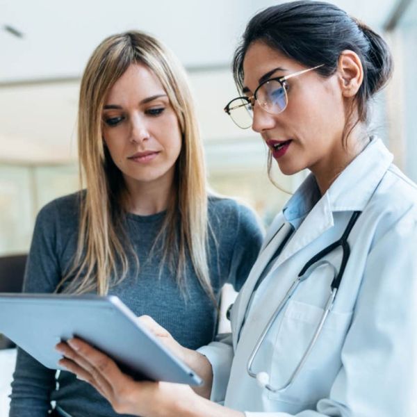 woman getting second opinion from doctor