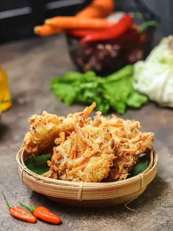 Bakwan sayur, or bala-bala, or ote-ote, or vegetable fritter, is an Indonesian snack made from flour, cabbage, carrots, and bean sprouts, served with chili pepper, peanut sauce, or sambal