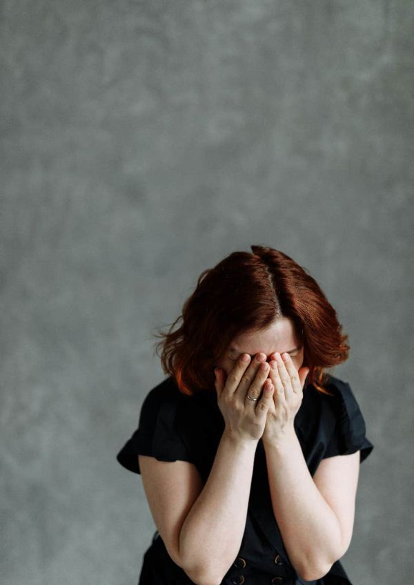 woman overwhelmed by being disliked