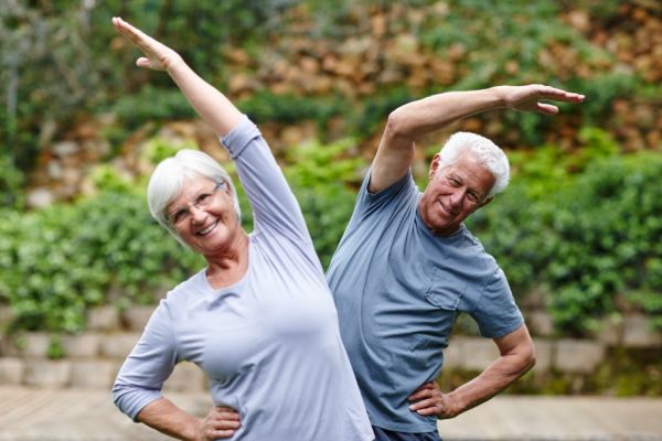 Happy older couple exercising