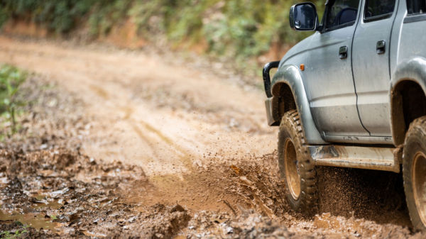 Truck driving on unpaved road