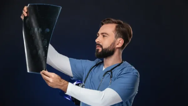 Doctor Checking X Ray Report Doctor Checking X-Ray Report