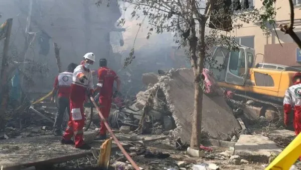 Rescuers work at the site of a damaged building, in the aftermath of Israeli strikes, in Tehran, Iran, June 13, 2025. Iranian Red Crescent Society/WANA (West Asia News Agency)/Handout via REUTERS Purchase Licensing Rights