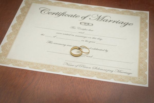 Wedding rings on a marriage certificate.