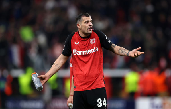 LEVERKUSEN, GERMANY - MARCH 11: Granit Xhaka of Bayer 04 Leverkusen reacts at full time during the UEFA Champions League 2024/25 Round of 16 second leg match between Bayer 04 Leverkusen and FC Bayern München at BayArena on March 11, 2025 in Leverkusen, Germany. (Photo by Lars Baron/Getty Images)
