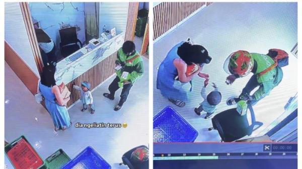KISAH VIRAL - Seorang driver ojol yang sedang mencari nafkah didampingi oleh anaknya yang masih berusia dua tahun. Kisah itu viral di media sosial setelah dibagikan oleh Anita Hartono. 