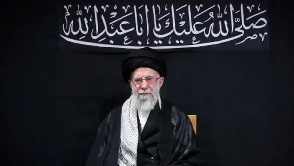 This handout picture released by the office of Irans Supreme Leader Ayatollah Ali Khamenei on July 5, 2025 shows him (R) waving to the audience during a mourning ceremony in Tehran marking the ninth day of the Islamic month of Muharram in the lead-up to Ashura, a 10-day period commemorating the seventh century killing of Prophet Mohammeds grandson Imam Hussein. Irans supreme leader on July 5 made his first public appearance since the outbreak of his countrys recent 12-day war with Israel, state media reported, greeting worshippers and being cheered at a mosque in a video broadcast by state television. (Photo by LEADER OFFICE / AFP) / === RESTRICTED TO EDITORIAL USE - MANDATORY CREDIT 