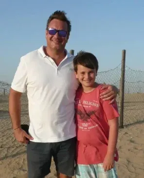 A-childhood-photo-of-Gus-Atkinson-with-his-father