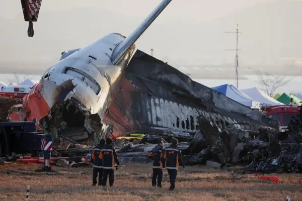 Rescuers work near the wreckage of the Jeju Air aircraft that went off the runway and crashed at Muan International Airport, in Muan, South Korea, December 30, 2024. REUTERS/Kim Hong-Ji     TPX IMAGES OF THE DAY