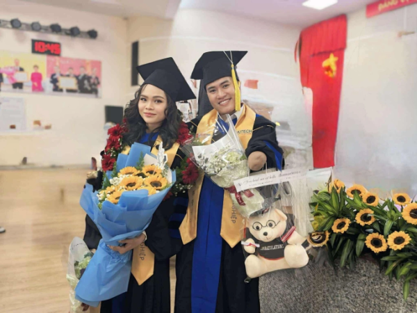 Nguyen Ngoc Nhut (R) and his friend at his graduation ceremony at Ho Chi Minh City University of Technology (HUTECH). Photo courtesy of Nhut