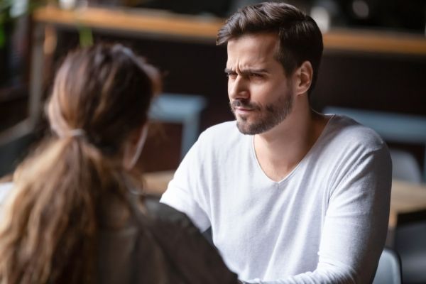 A man looking doubtful during a date.