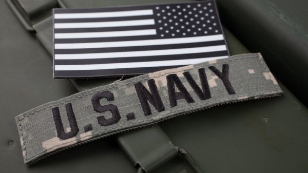 U.S. Navy and U.S flag patches  in black and white on ammo box