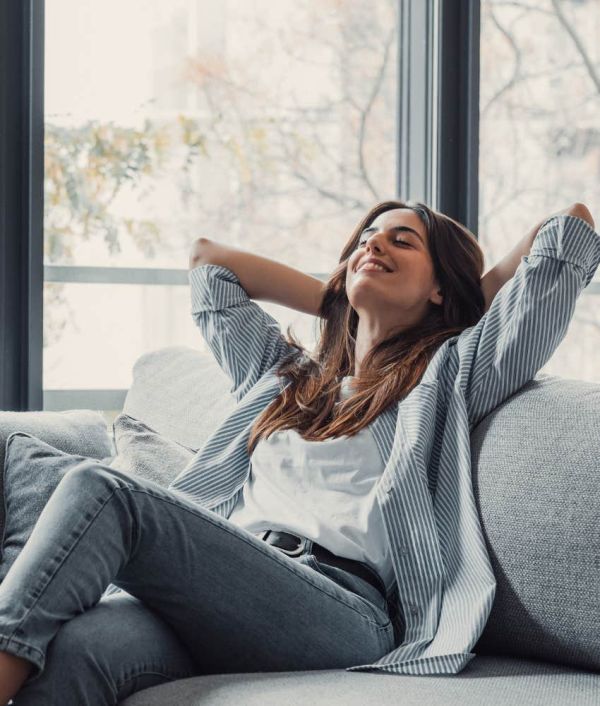 Woman is happy and relaxed.