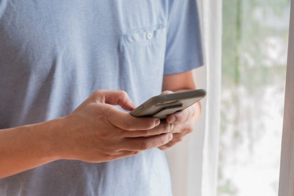 Close-up of a person using a smartphone.