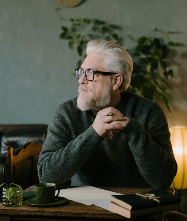 man journaling hobbies emotionally intelligent people find enjoyable