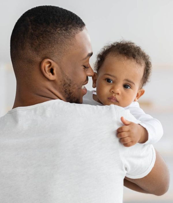 man holding baby
