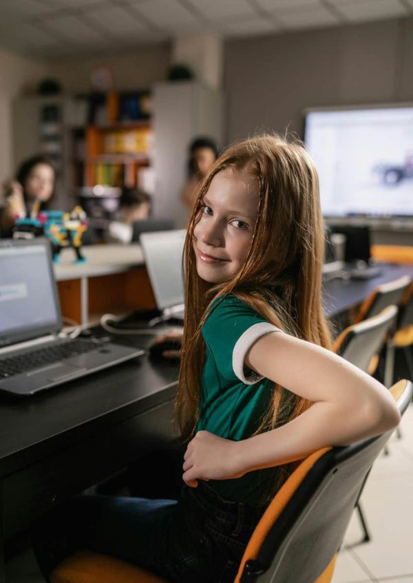 high school student writing an essay at school