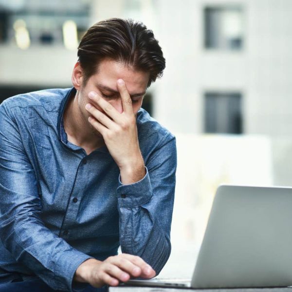man realizing he's overdrawn after keeping extra money from an ATM
