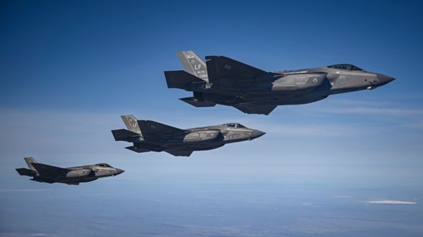 three F-35 fighter jets flying in formation