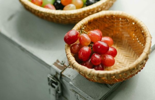A basket of red grapes. Photo by Pexels