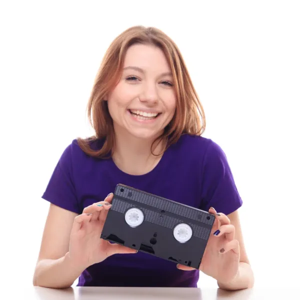 woman holding vhs tape 90s relic making comeback