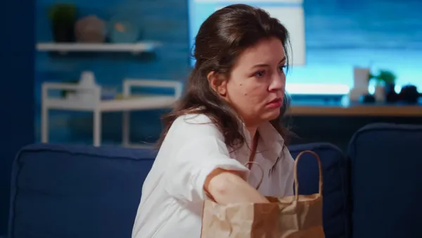 woman feeling guilty for not eating all her food