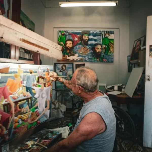 man painting a picture