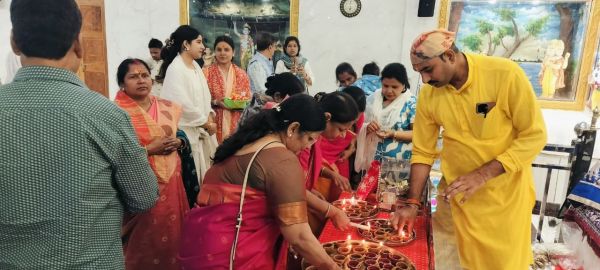 Devotees burning the island in ritual Devotees burning the island in ritual