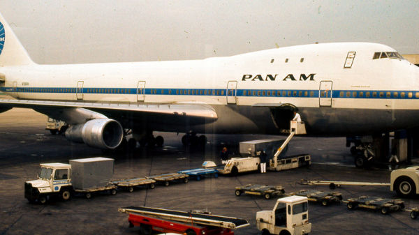 A vintage photo luggage being loaded onto a Pan Am plane in the 1970s